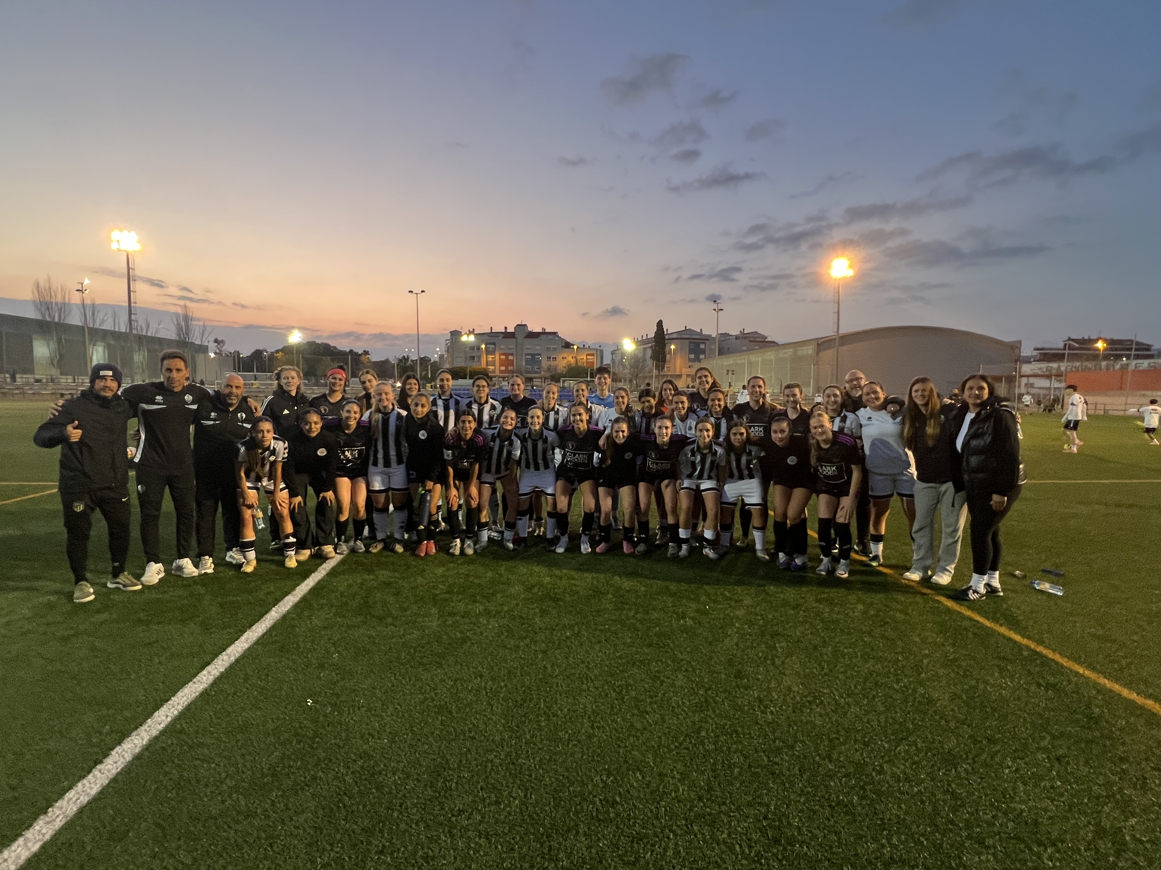 Women's soccer team at sunset